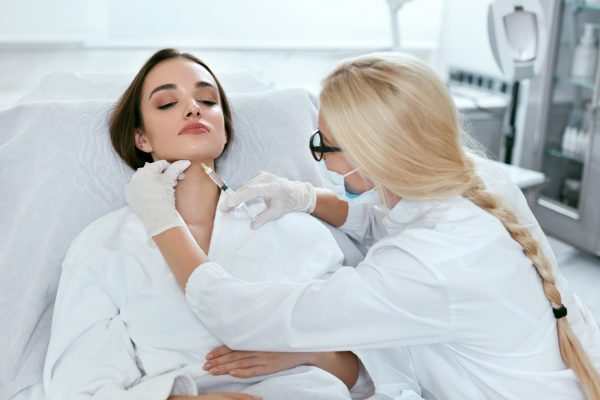 Beauty Injections. Woman Getting Face Lifting Procedure Closeup, Cosmetology Injection At Clinic. High Resolution